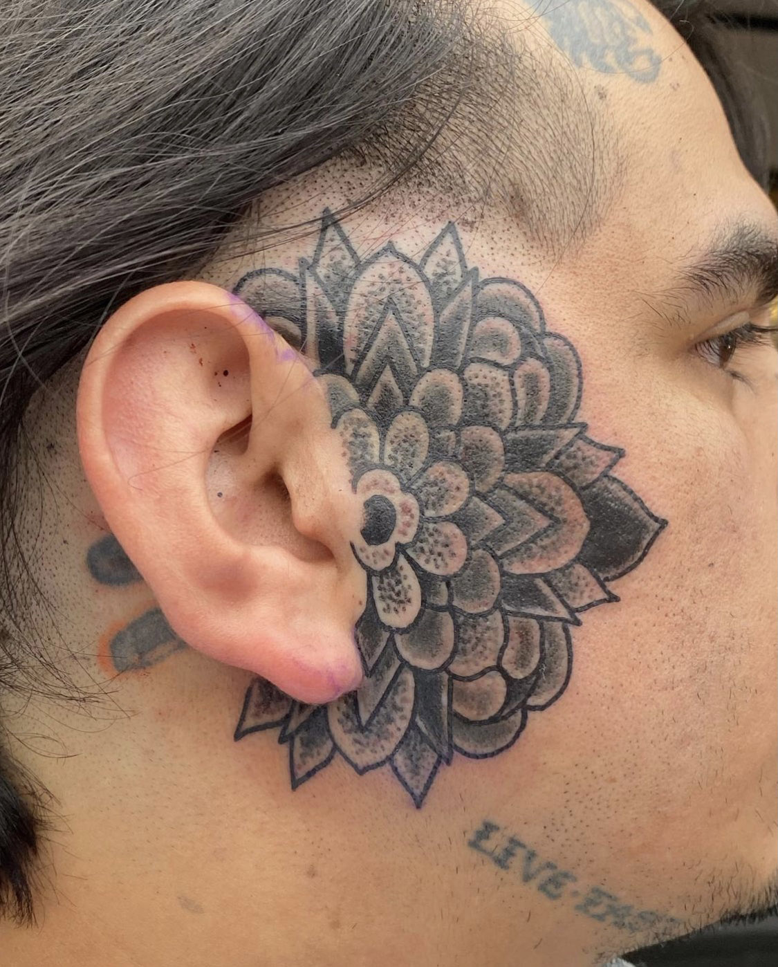 Mandala face tattoo | Under the Needle